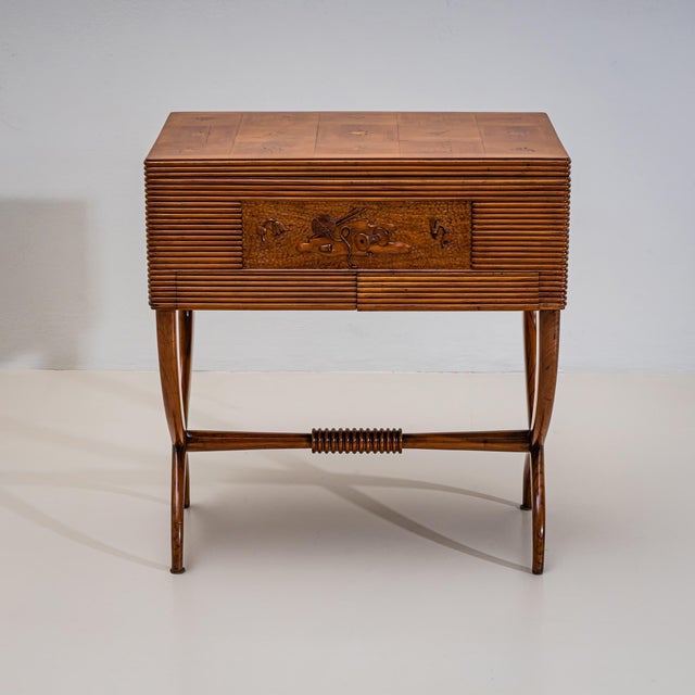 Sewing cabinet with a hinged top and two drawers, raised on a scissor-form base in cherrywood. The top is decorated with...
