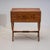 Sewing cabinet with a hinged top and two drawers, raised on a scissor-form base in cherrywood. The top is decorated with...