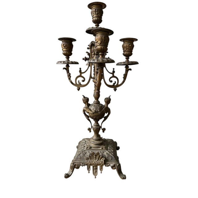 ### Antique Brass Candelabra - Elegance in Illumination Elevate your interior decor with this exquisite antique brass...