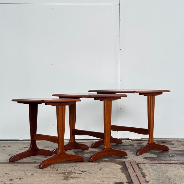 Nest of tables in original condition, showing minor signs of use consistent with age. Clean, practical mid-century form...