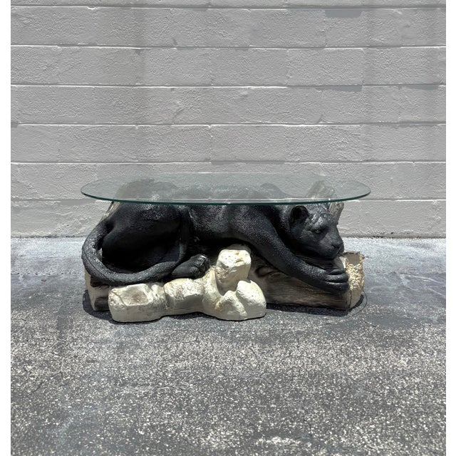 A sculptural coffee table that blurs the line between furniture and object, this vintage piece features a reclining black...