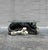 A sculptural coffee table that blurs the line between furniture and object, this vintage piece features a reclining black...