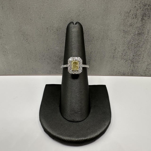 This natural yellow diamond cocktail ring is crafted in 14kt white gold and showcases a stunning 0.82 carat natural yellow...