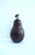 A cast iron pear fruit doorstop, (door stop, doorstopper), with a dark brown enamel surface and leaf detail, circa...