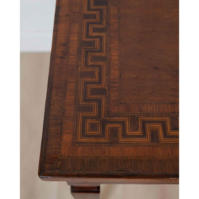 An elegant late 18th century Tuscan rectangular table, beautifully veneered in walnut and distinguished by its refined...