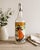 Victorian Vintage Art Nouveau “Ice Water” Swing Top Glass Bottle Featuring Victorian Lady Skating For Sale - Image 3 of 12