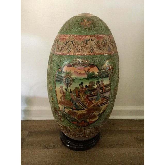 Gorgeous vintage, huge size Satsuma style Hand-Painted Gold Porcelain Egg over a wood pedestal with Geishas scene, the...
