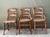 This curated trio of vintage chairs offers a charming "collected" aesthetic, perfect for adding texture and history to a...