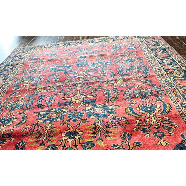 This beautiful antique Persian Mohajeran Sarouk, woven circa 1910, is a fine example of the elegant craftsmanship and...