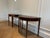 Hepplewhite style early twentieth century demi-lune tables in lovely condition. Beautiful wood with inlays and tapered legs.