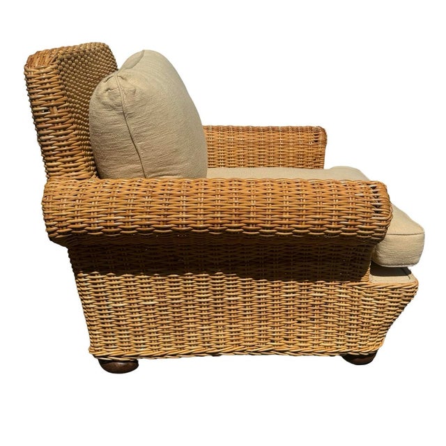 Beautiful high-end Walters Wicker lounge chair with neutral cushions. Classic woven wicker design with oversized rolled...