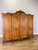 A beautifully detailed Vintage French Louis wardrobe in oak, featuring four panelled doors with elaborate carved...