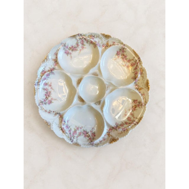 Beautiful antique French porcelain serving plate by Theodore Haviland, Limoges, France, featuring six molded wells...
