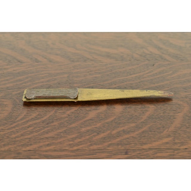A gorgeous Arts & Crafts period brass finished hand hammered copper letter opener By Roycroft (signed with impressed orb...