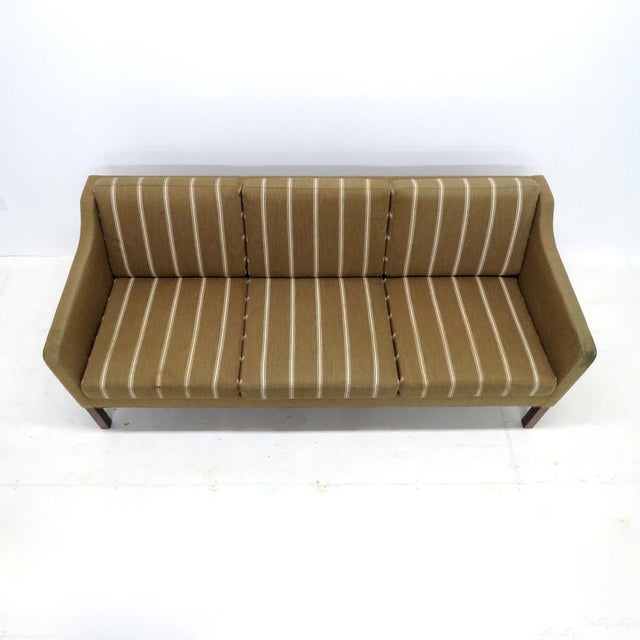 Stunning three-seat sofa model no. 2223, designed by Børge Mogensen in 1963 and produced by Frederica Stolefabrik,...