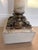 Elegant vintage Neoclassical pedestal crafted from richly figured cream and blush-toned onyx or stone, accented with...