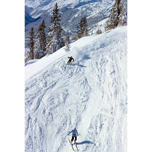Skiers On The Piste by Toni Frissell Two skiers on the piste at the St. Anton ski resort, Austria, 1955. (Photo by Toni...