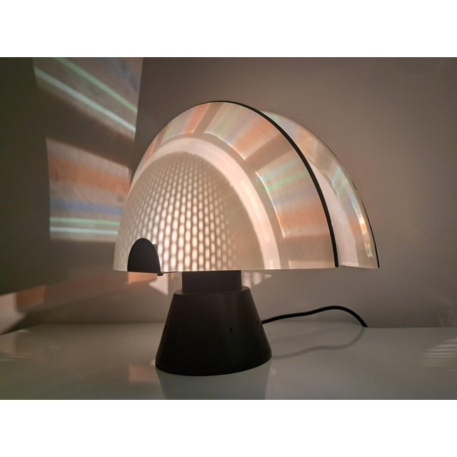 Table lamp, Murano production, 1980s design, featuring clean lines, simple shapes, and smooth surfaces. The matte metal...