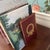 20th Century Red Leather Brass Laurel Wreath Bookemds a Pair For Sale - Image 11 of 12