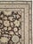 This mid-20th-century Persian Malayer rug presents a richly developed floral composition across a deep brown field. Large...