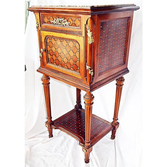 Exceptional quality 19c French single marble top nightstand chevet in Louis XVI style, multiple wood parquetry overall,...