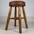 A beautifully crafted 20th-century oak stool, exceptionally well made and distinguished by its sturdy construction,...