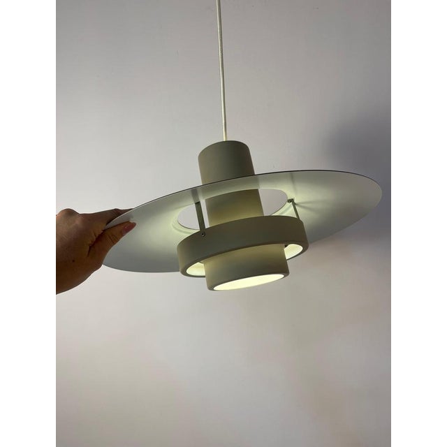 The Falcon pendant lamp, designed in 1969 by Andreas Hansen for the renowned Danish manufacturer Fog & Mørup, is a true...