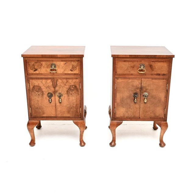 A smart and very well made pair of antique burr walnut bedside cabinets. They were made in England, they date from around...