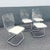 A striking set of Mid Century Modern dining chairs by Hill Manufacturing featuring a sleek combination of transparent...