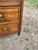 A charming 19th-century French Louis XVI commode, crafted in solid walnut with beautifully figured walnut veneer. This...