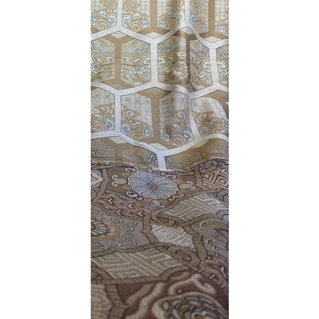 Two half-panels sewn together. One pattern is a geometric print, while the other is more floral. Both panels are in shades...