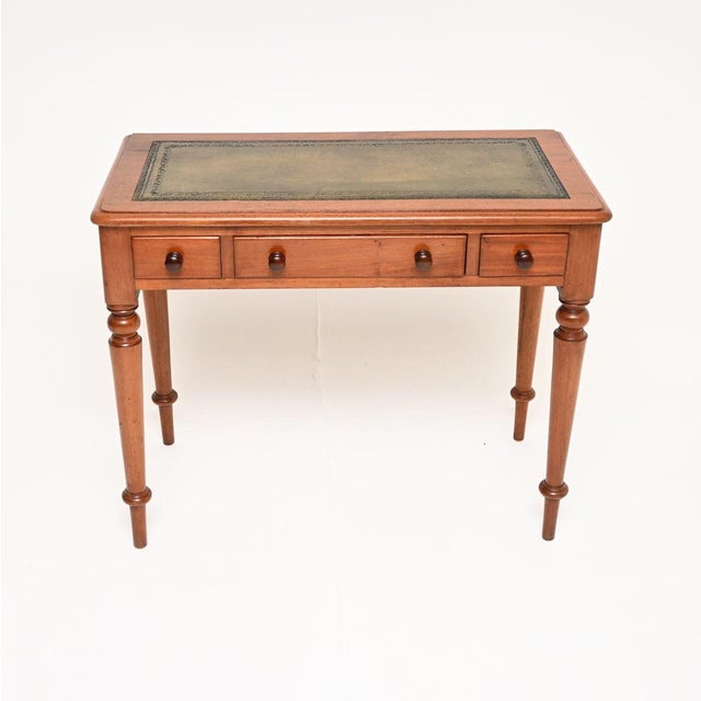A charming antique Victorian leather top writing table / desk. This was made in England, it dates from around the...