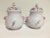 This pair of jars are signed Moustier France Segries The hand painting is very detailed The pierced covers allow the...