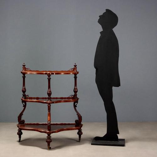 Louis Philippe walnut and burr walnut etagere. Three molded shelves supported by a first set of three curved legs carved...