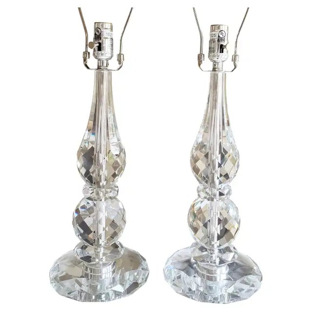 Gorgeous pair of Ralph Lauren crystal table lamps. These spectacular table lamps feature diamond cut crystal and chrome...