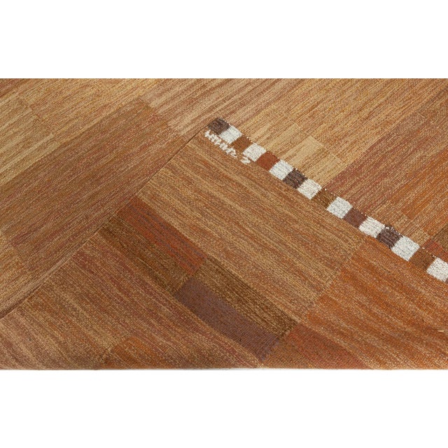 A masterclass in minimalist texture and tone, this vintage Swedish flat-weave rug by celebrated textile artist Marianne...