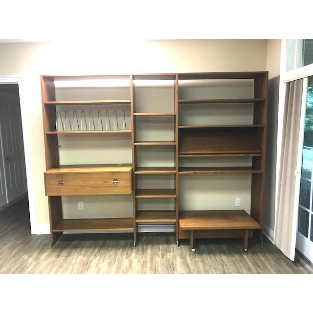 This free standing 70s Danish Modern teak wall unit is by Hans Wegner for Mobler RY100. Free-standing and sturdy, it is...