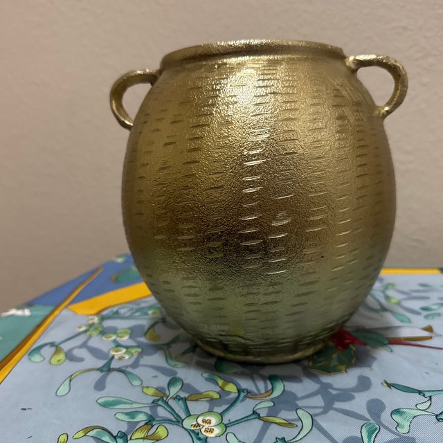 Add a touch of timeless warmth to your space with this beautiful, vintage-inspired antique gold decorative urn. This...