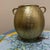 Add a touch of timeless warmth to your space with this beautiful, vintage-inspired antique gold decorative urn. This...