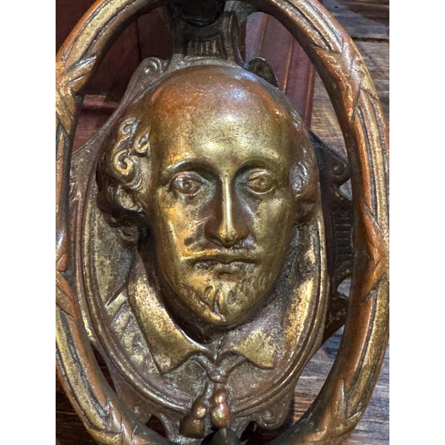 Make a statement when you adorn your door with this antique English early 19th century bronze door knocker featuring the...