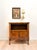 A charming French Provincial cabinet with soft, romantic lines and warm walnut tones. An open display shelf up top is...