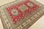 This traditional tribal geometric Caucasian Kazak rug is hand-knotted with an all-wool pile on a cotton foundation. This...