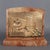 A very rare and curious tabletop sculpture. This piece is a brass plaque mounted on marble, depicting a humorous and...
