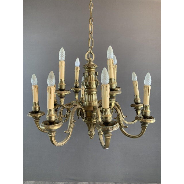 Elegant Bronze Chandelier, Early 20th Century This magnificent bronze chandelier is a tribute to classic craftsmanship and...