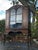 An elegant antique French Provincial display cabinet showcasing graceful lines, beautifully carved detailing, and a warm...