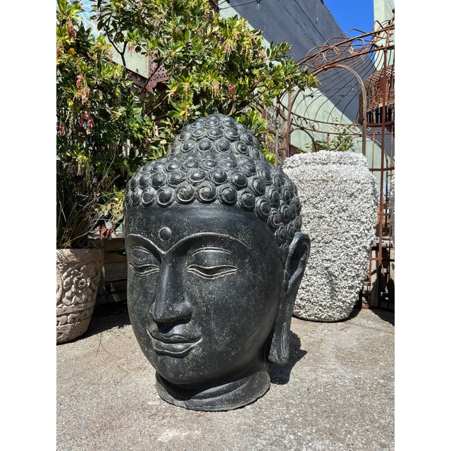Vintage cast faux stone Buddha head statue. Great for outdoor or indoor use. Each will have variations in tones, textures,...