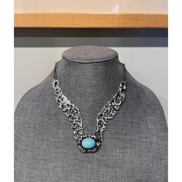 A sterling silver necklace with a turquoise color cabochon set in by Mexican silversmith Tane Orfebres circa 1960-1970s....