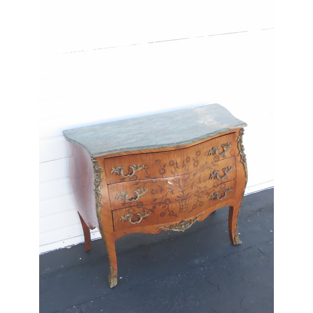 This classic Dresser is made out of wood, solid wood, veneer, metal, and marble. This Commode was made in the lovely...