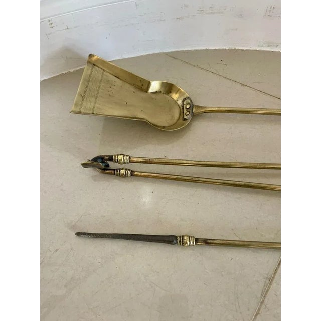 Antique set of three Victorian quality brass fire irons consisting of a quality brass shovel, poker and fire tongs...
