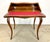 A fine and very well made Ladies writing desk in Louis XV style with highly detailed marquetry in exotic woods with bronze...